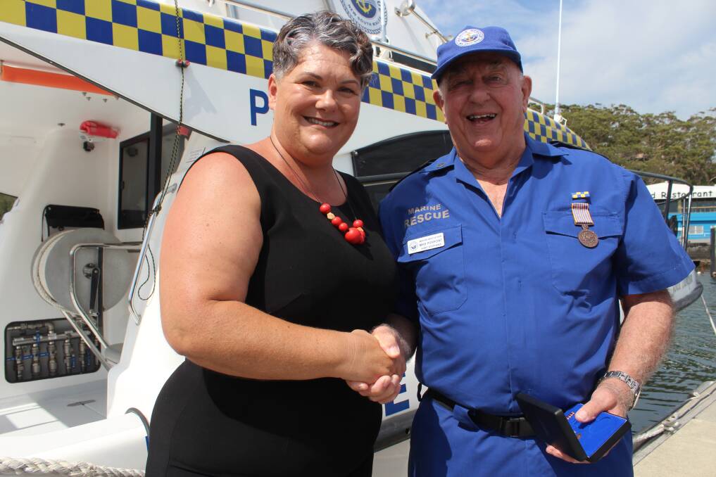 BRAVO: Paterson MP Meryl Swanson awards Corlette resident Mike Pierpoint for his 16 years of service at Port Stephens Marine Rescue. Picture: Supplied 