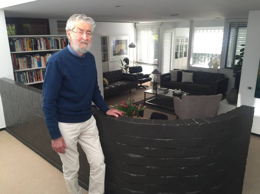 Brian Suters inside the Domus 1 design, with his signature curved wall, which he created in the 1970s. Picture: Scott Bevan