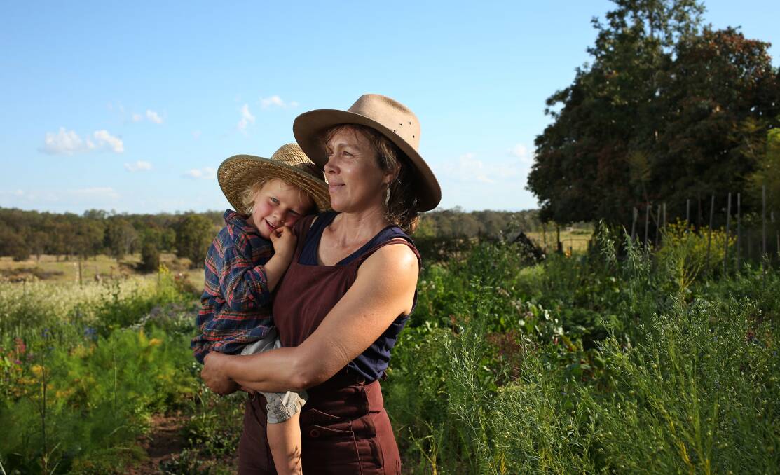 FRESH SHOOTS: Shepherds Ground Farm and Village founder Lucie Bruvel and son Blaise in their garden. Pictures: Simone De Peak