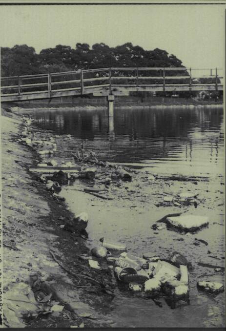 The rubbish-strewn and vegetation-bare bank of Throsby Creek, near the footbridge linking Islington and Tighes Hill, in 1981. 