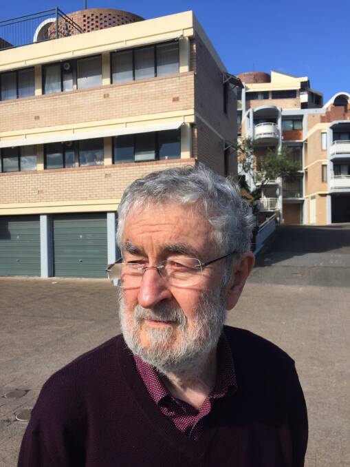 Brian Suters amid the public and private housing development in Newcastle East. Picture: Scott Bevan