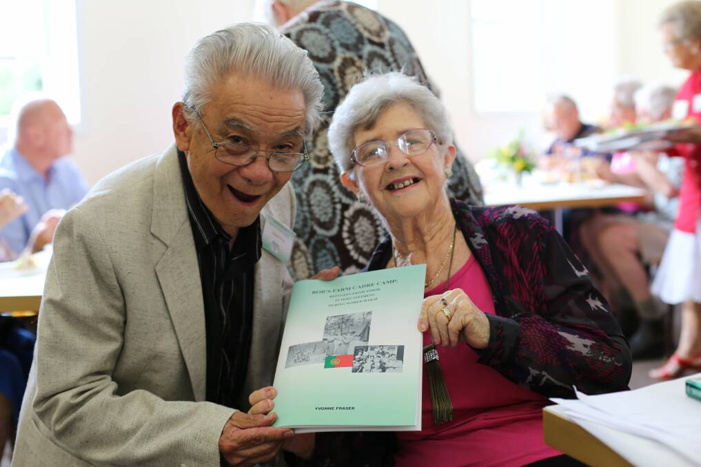 DELIGHTED: Chance Yeow and Lorraine Cottam with the Port Stephens Family History Society's new book, Bobs Farm Cadre Camp. Picture: Ellie-Marie Watts