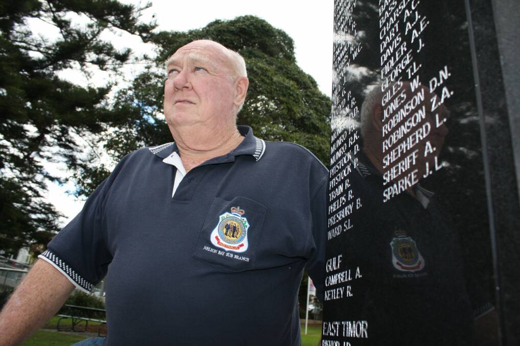 ACKNOWLEDGEMENT: Nelson Bay RSL sub-branch secretary Tony Minchin is happy to show off the latest list of names on the Apex Park war memorial. Picture: Stephen Wark