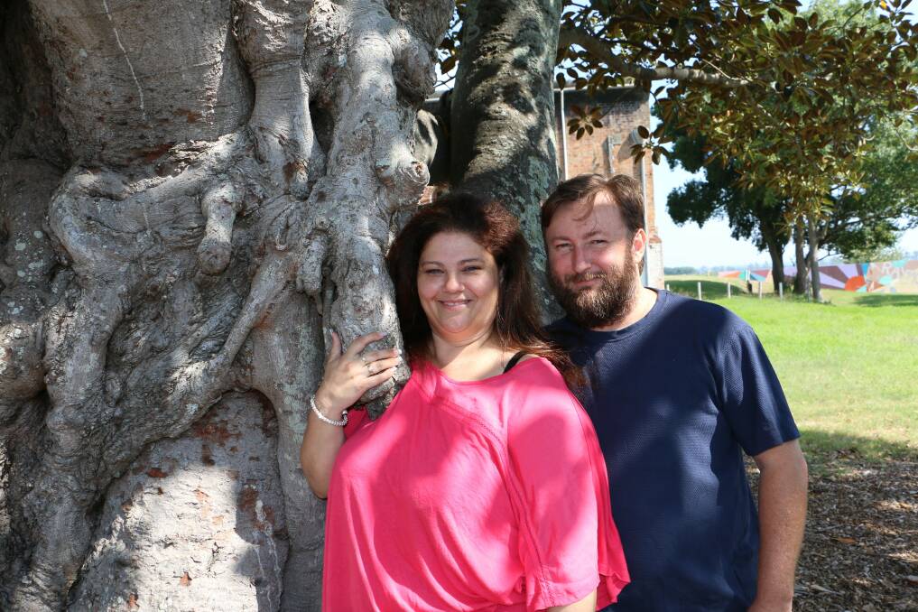LONG ENGAGEMENT: Soon to be married under the wedding tree Laura Taylor and Chris Evans in King Street, Raymond Terrace. Picture: Stephen Wark