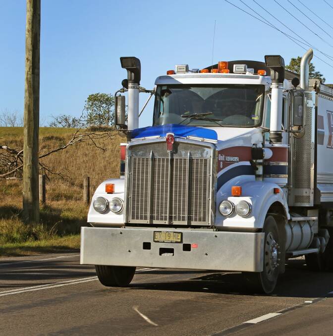TOO MANY: A file photo of a truck and dog leaving Macka's Sand Quarry in 2015. The Department of Planning and Environment has fined the quarry $15,000.