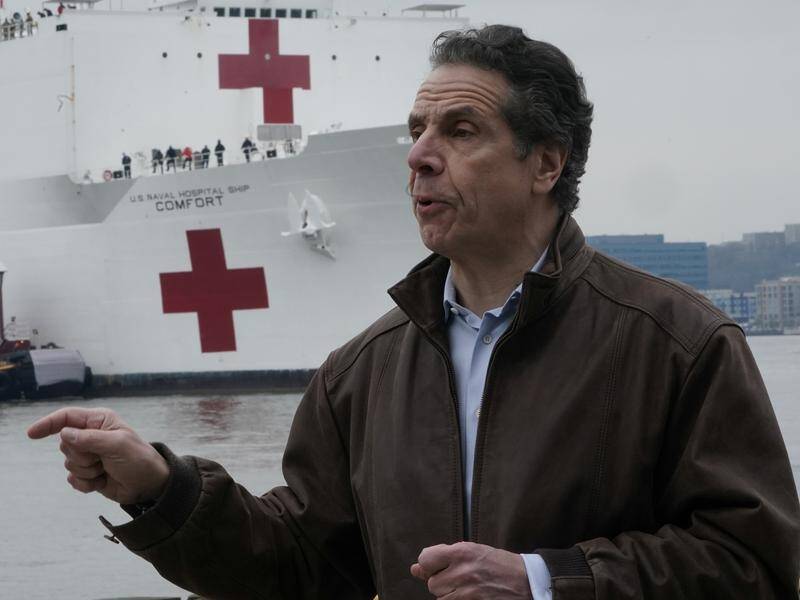 A 1000-bed hospital ship has docked in New York to help relieve the city's overwhelmed hospitals.