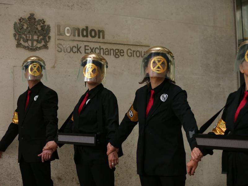 Protesters glued themselves to the London Stock Exchange building.