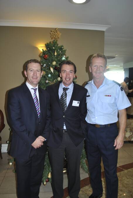 BOOM TIPPED: Port Stephens Council's Mike McIntosh, UDIA Hunter chapter chairman Geoffrey Rock and RAAF Base Williamtown Wing Commander Jeffrey Leeke discuss planned infrastructure spending.