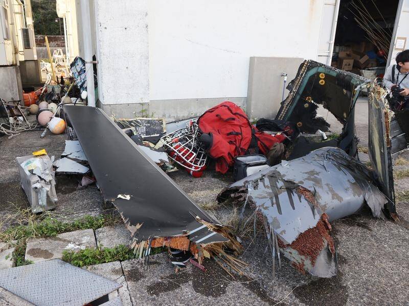 Some wreckage from a US Air Force Osprey has been recovered after a crash that killed one person. (EPA PHOTO)
