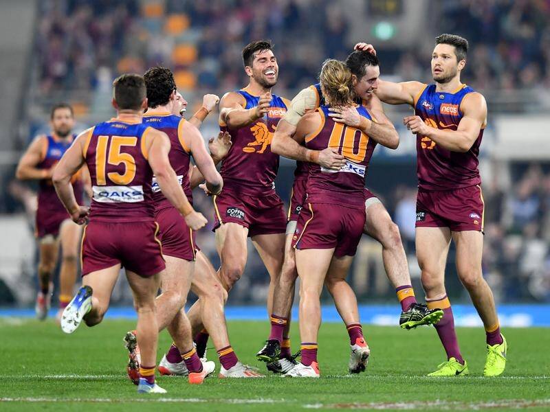 The Brisbane Lions have edged North Melbourne by 12 points in an AFL thriller.