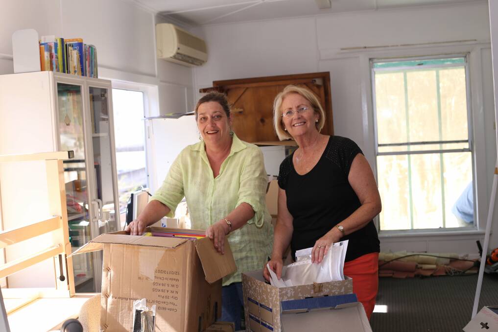 UNPACKING: Sue Platcher and Lynn Vatner at the new Donald Street Yacaaba Centre. Picture: Ellie-Marie Watts