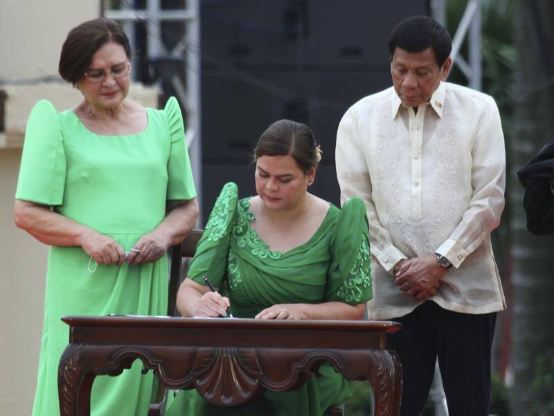 Sara Duterte-Carpio (centre) during her oath taking as vice-president of the Philippines.