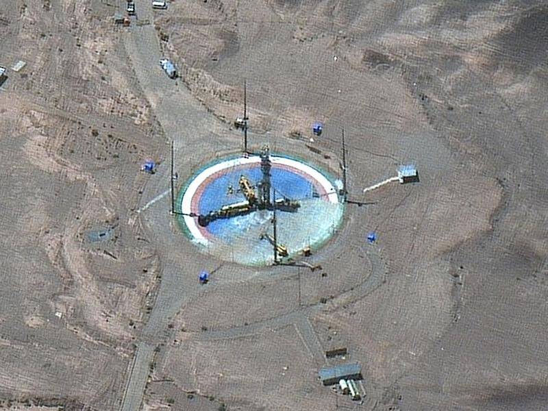 The satellite images show a rocket preparing to be erected at Imam Khomeini Space Center.