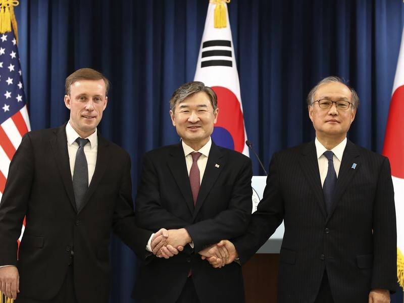 US, Korean and Japanese advisers call for a push to curb the North's nuclear weapons development. (AP PHOTO)
