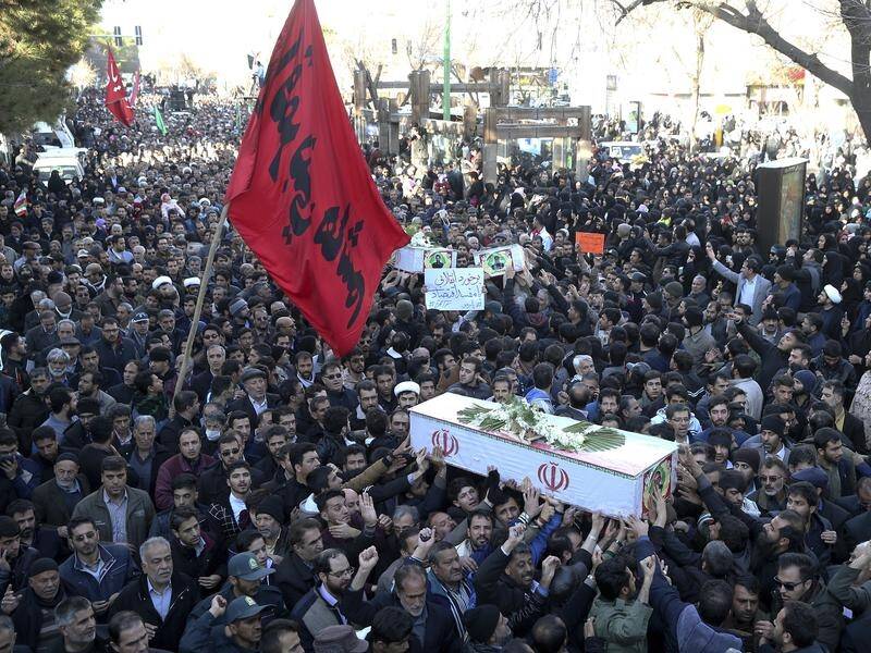 A mass funeral was held for 27 members of Iran's Revolutionary Guard who died in a bomb attack.