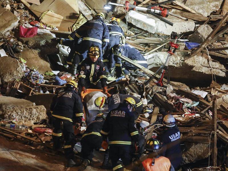 Firefighters are looking for four people who were buried when two houses collapsed in Chile.