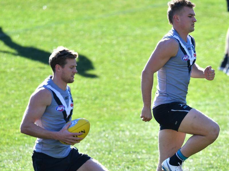 Tom Jonas (l) and Ollie Wines will be Port co-captains in a first for the club.