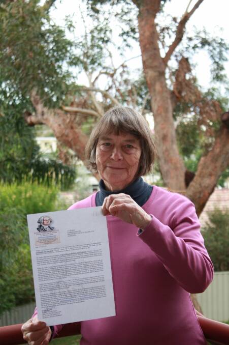 WARNING: Susan Quean with the scam letter. Picture: Stephen Wark