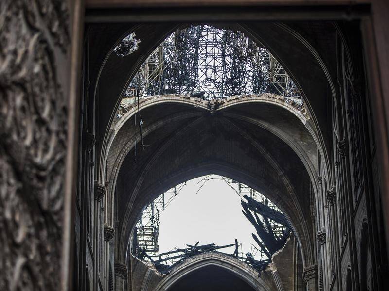 Holes seen in the dome inside the damaged Notre Dame cathedral in Paris.