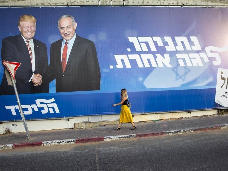 An election billboard in Tel Aviv shows Israeli PM Benjamin Netanyahu with US President Donald Trump