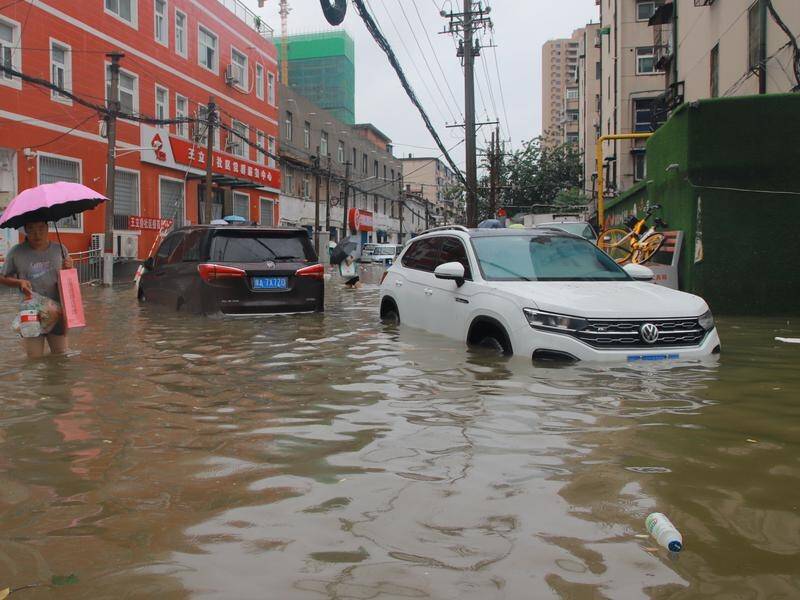 Flooding in Zhengzhou has stranded residents at schools, apartments and offices.