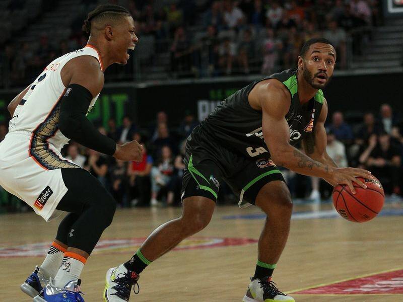 John Roberson (r) hit a game-high 32 points in the Phoenix's overtime win over Cairns in Melbourne.