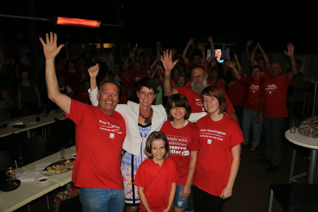 JUBILANT: Kate Washington celebrates the news of her victory with family and supporters on Saturday night.