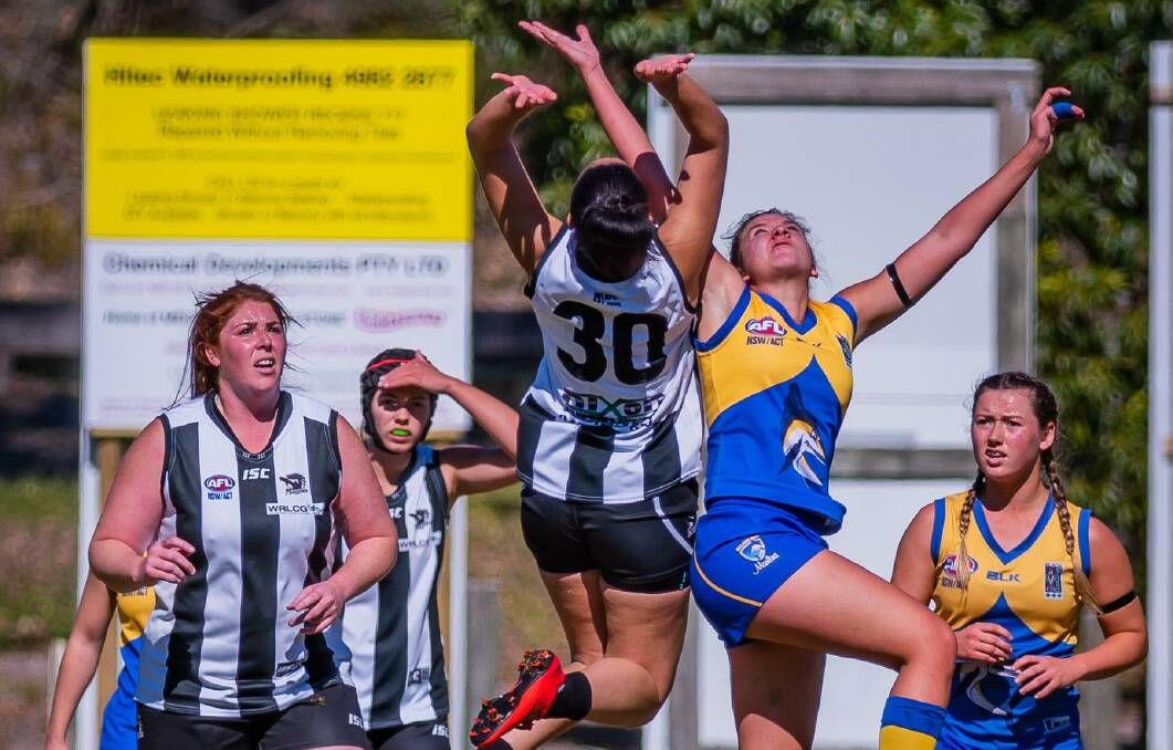 SOARING: Kanesha Murray and Natasha Flint rise for the ball as the Marlins and Magpies went head to head in the final round, with Nelson Bay gunning for the top spot. Picture: Ken Hogan