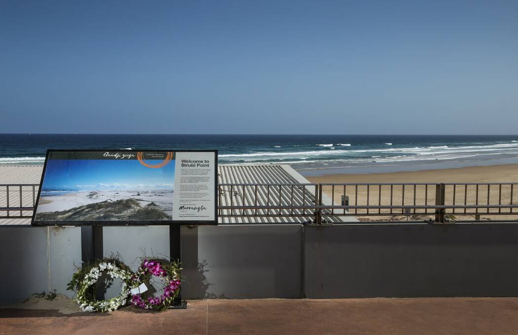 Tribute: Flowers left at Birubi Point Surf Life Saving Club earlier this month. Picture: Marina Neil