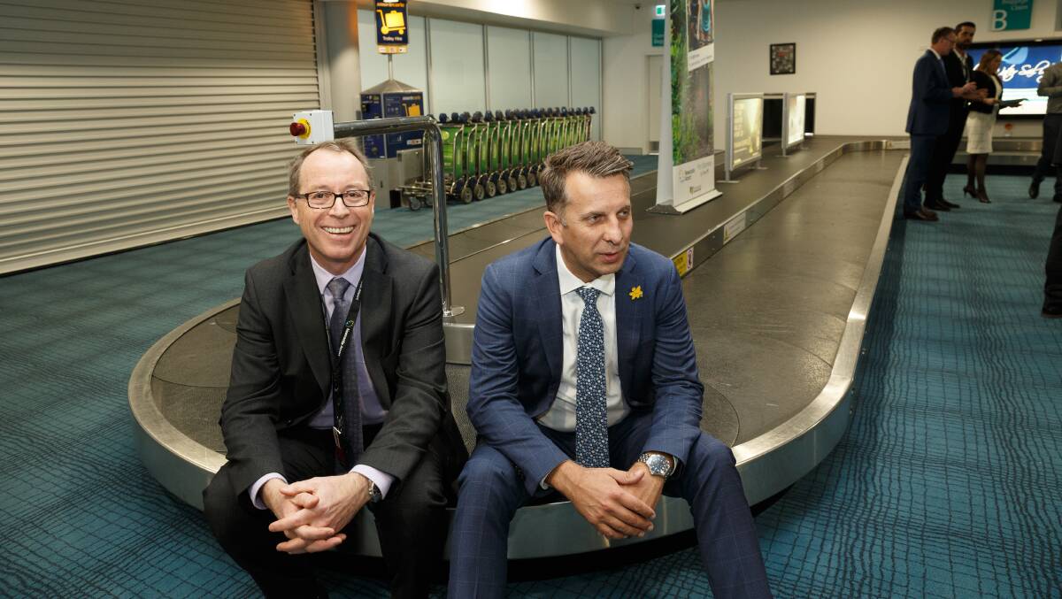 Newcastle Airport CEO Dr Peter Cock with NSW Transport Minister Andrew Constance at the opening of the airport's international terminal facilities earlier this year. Picture: Max Mason-Hubers
