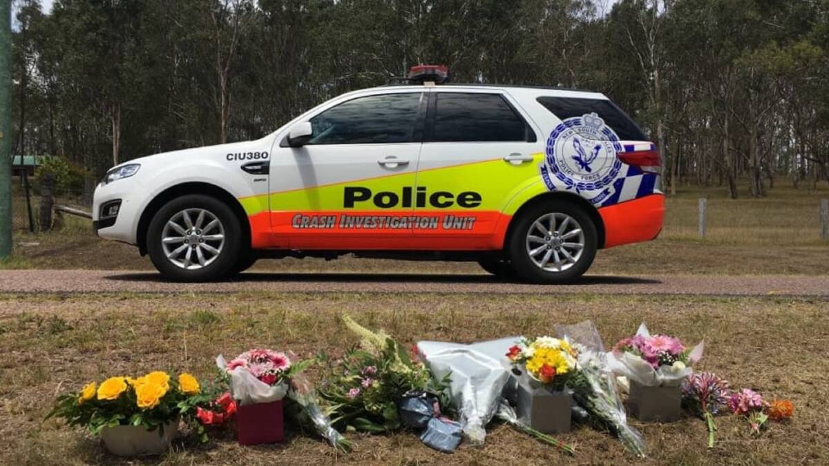 TRAGEDY: A roadside memorial on Warrigal Close, Brandy Hill, after a teenage girl was killed by a car as she walked to the school bus stop. Picture: Brodie Owen 
