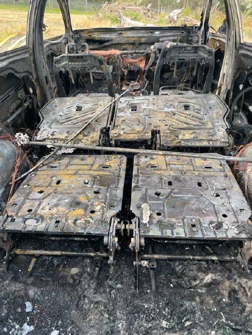 The Santa Fe found burnt out in Masonite Road, Heatherbrae after the shooting. Picture: Supplied