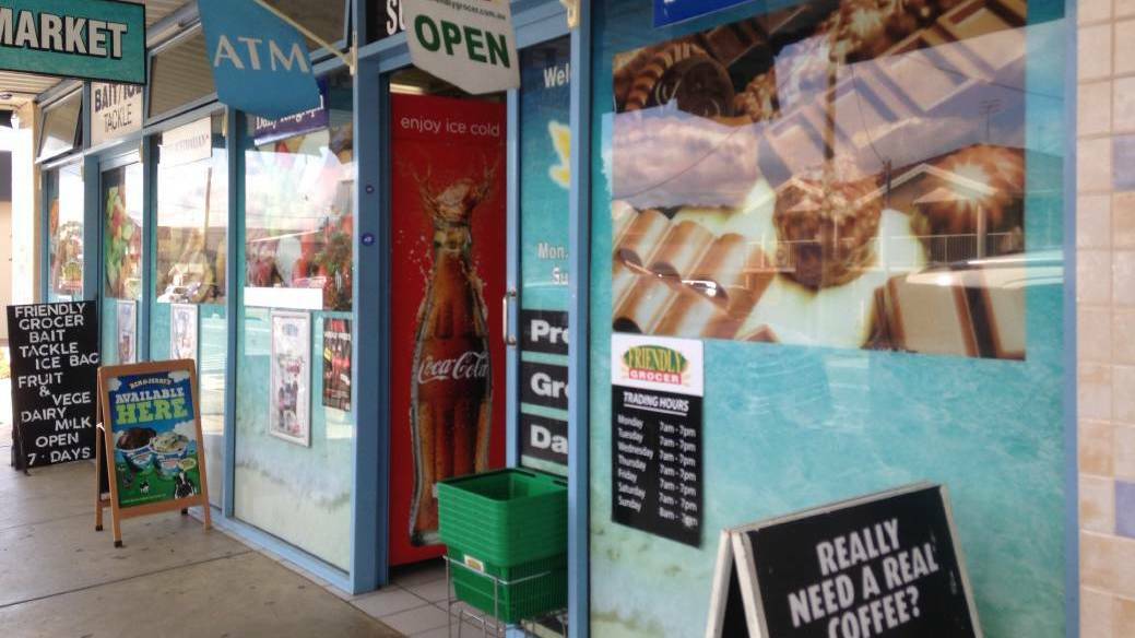 CONFRONTING: Salamander Bay's Friendly Grocer where members of the public locked a woman inside during a stabbing spree last month.