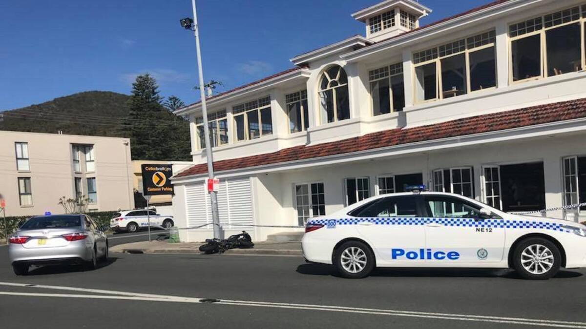 SCENE: Rhys James Allen's black Hyosung motorcycle on its side outside the Shoal Bay Country club in the aftermath of the botched daytime robbery on April 30 this year. Picture: Adam Dawkings