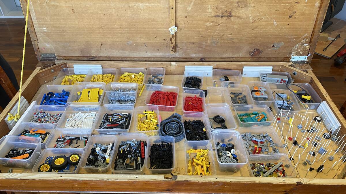 LEGO TABLE: Neville's dining table has secret storage for his Lego bricks. Photo: Alanna Tomazin