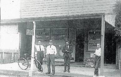 GETTING THE NEWS OUT: William Brown (second left) with his son Cecil (far right) in front of the Examiner King Street office about 1919.