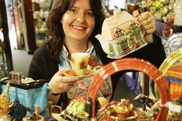 HANDLE WITH CARE: Kylie Richards with some of the teapots in the exhibition.  –  Picture by Anita Jones