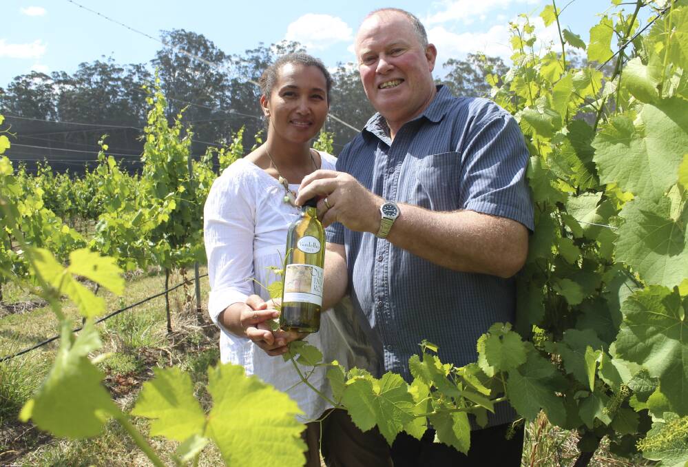 HIGH QUALITY: Old Inn Road Vineyard owners Sooze Bosire and Dale Bradshaw among the vines with their award-winning 2013 verdelho. Picture: Nathalie Craig