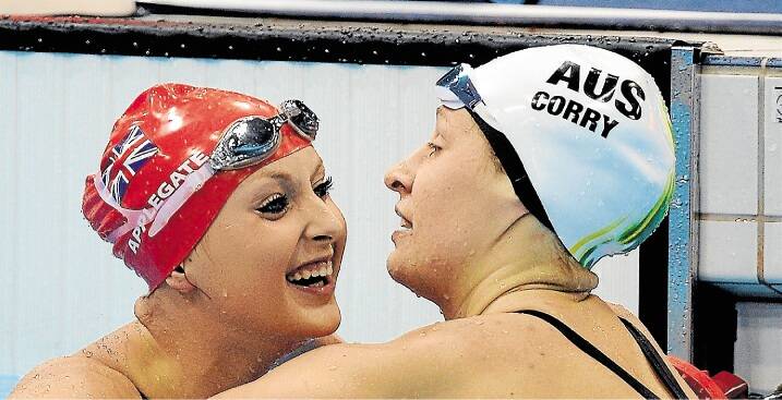 Taylor Corry, right, celebrates her silve medal win with gold medalist Jessica-Jane Applegate.
