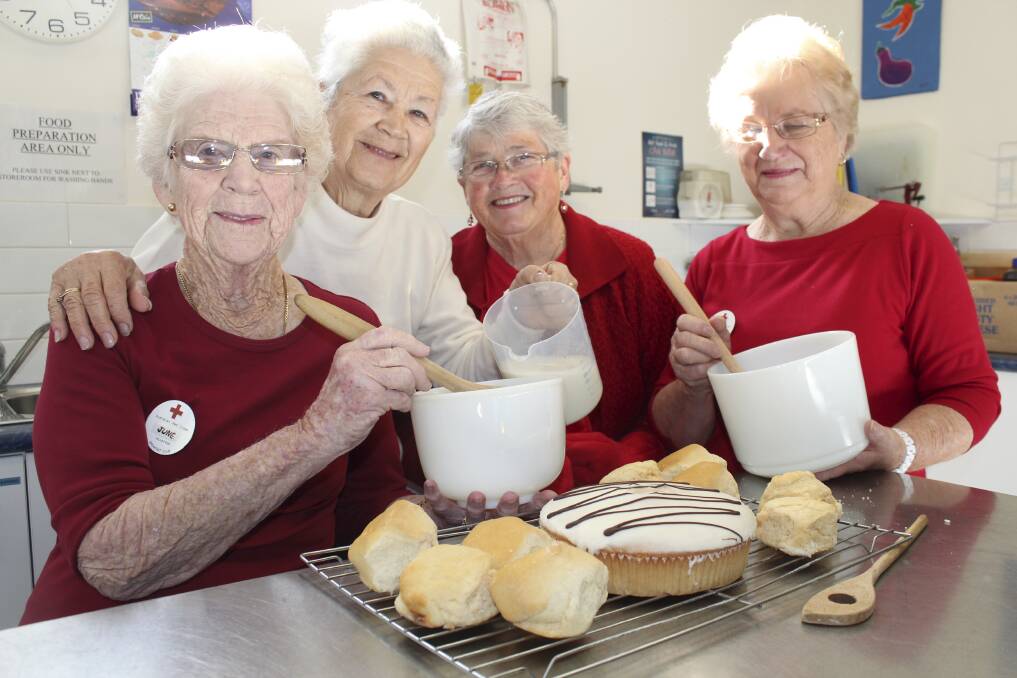The red cross ladies are ready to bake.